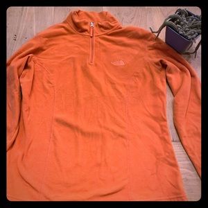 Orange North Face fleece zip up